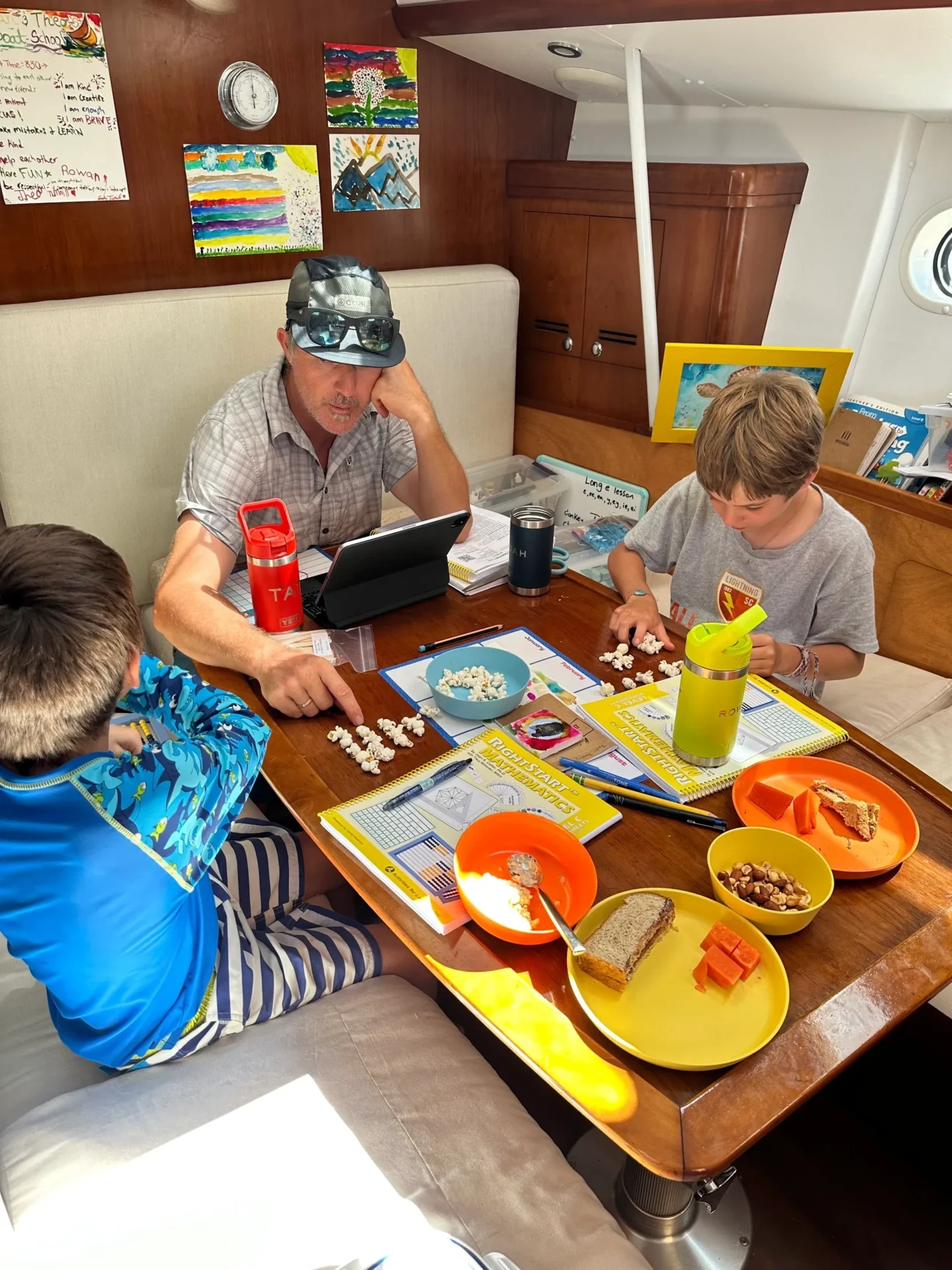 A group of people sitting at a table with plates.