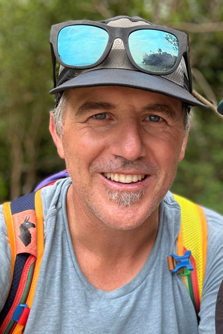 A man wearing safety gear and goggles.