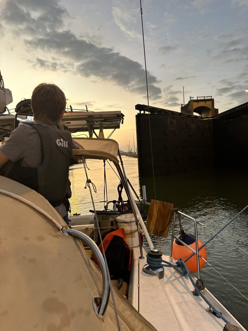 A man on a boat in the water.