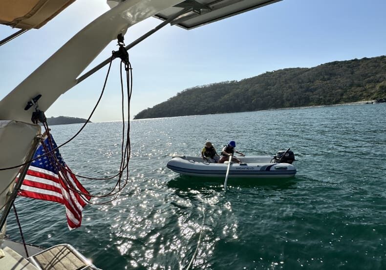 A boat with two people in it on the water.